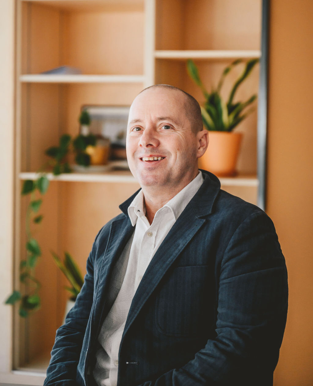 A photo of Larry Gold at our Rockingham Street offices. He is looking at the camera and smiling.